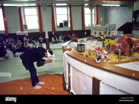 Inside a Sikh Temple with worshippers Stock Photo - Alamy