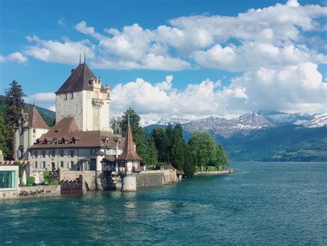 Passed this charming castle today on lake Thun, Switzerland. : r/castles