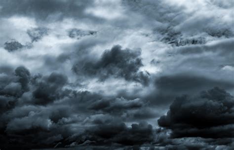 Dark dramatic sky and clouds. Background for death and sad concept. Gray sky and fluffy white ...