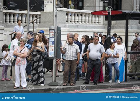 People Waiting at a Bus Stop Editorial Stock Photo - Image of covent, street: 75923683