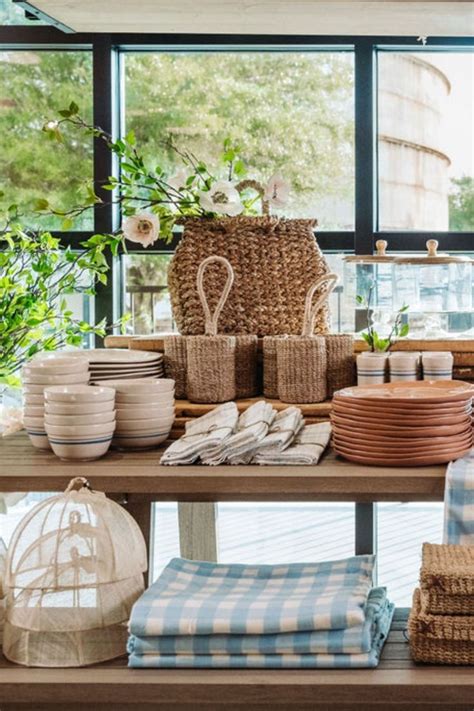 the table is set with dishes and baskets