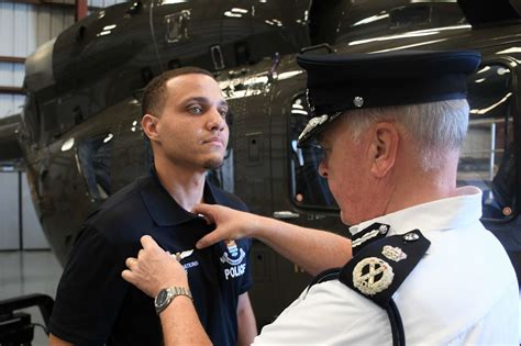 First Caymanian police helicopter pilot gets his wings - Cayman Compass