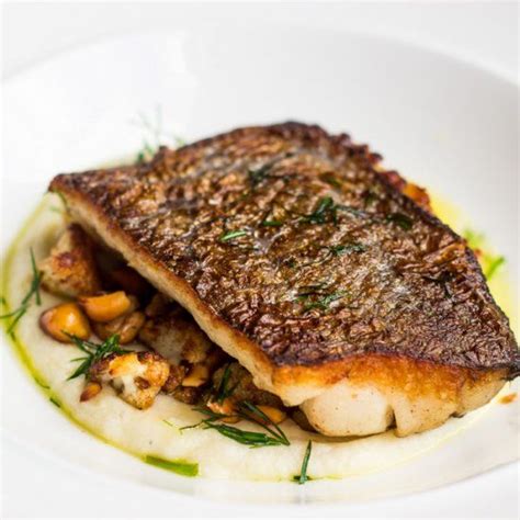 Pan-fried blue grenadier, cauliflower puree, cauliflower florets and roasted hazelnuts drizzled ...