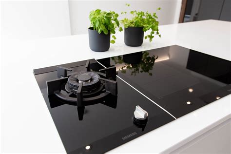 Siemens gas hob and induction hob on kitchen island. Based in Wembley ...