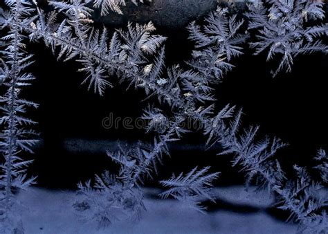 Frost patterns on glass stock image. Image of rays, crystal - 108886611