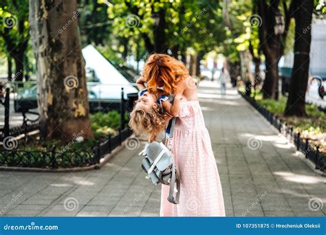 Woman Hugs Her Daughter, Holding Her in Her Arms Stock Image - Image of ...