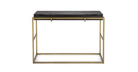 Cubic proportions. The Oscuro console features natural wood grain juxtaposed against brushed m ...