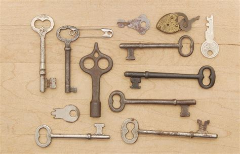 Lot of four antique steel and bronze 1800’s skeletons keys from furniture or door locks? One ...