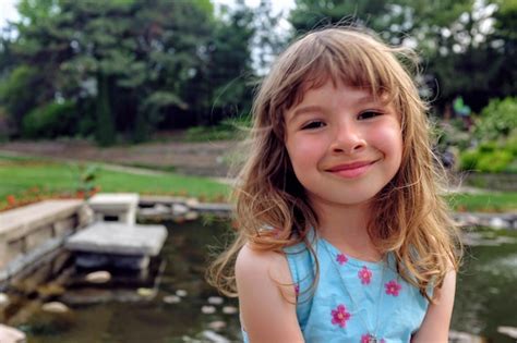 Premium Photo | Portrait of smiling girl outdoors