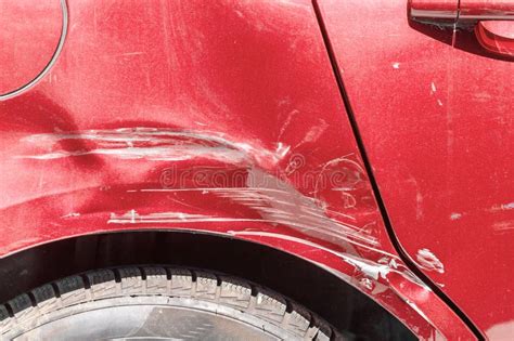 Red Scratched Car with Damaged Paint in Crash Accident on the Street or Collision on Parking Lot ...