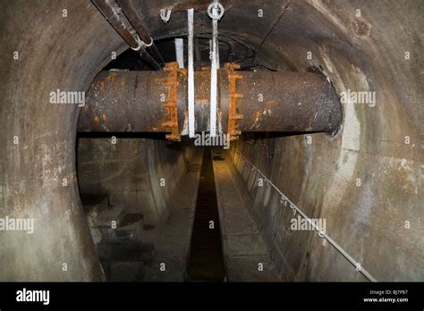 Sewer tunnel drain inside the Paris sewers – Visite Des Egouts De Stock Photo, Royalty Free ...