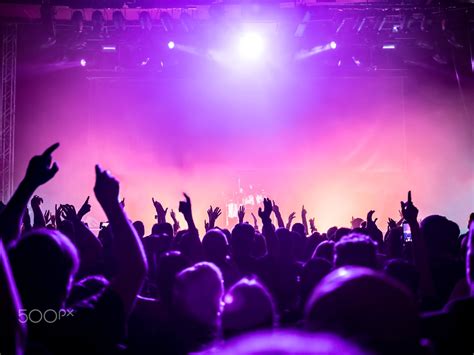 silhouettes of concert crowd - silhouettes of concert crowd in front of bright stage lights ...