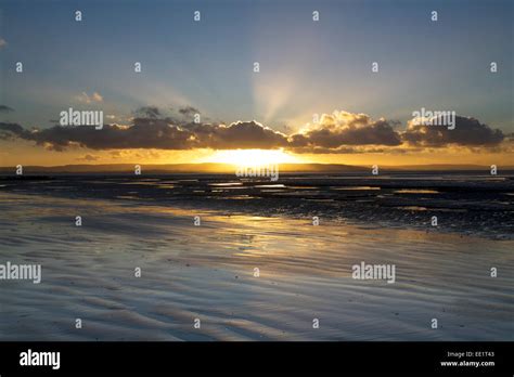 Sunset over Berrow Beach, Somerset, UK Stock Photo - Alamy