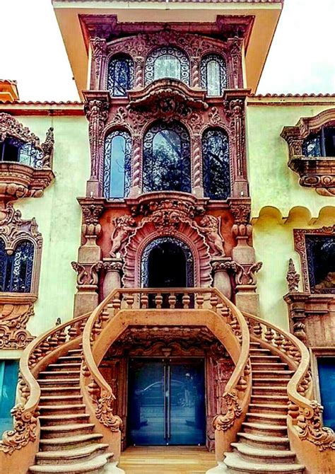 an ornate building with stairs leading up to it