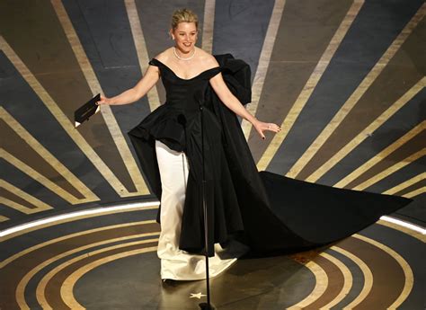 Oscars 2023: Elizabeth Banks Trips While Presenting Award | Us Weekly