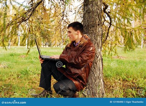 Man with laptop outdoor. stock photo. Image of meadow - 13190490