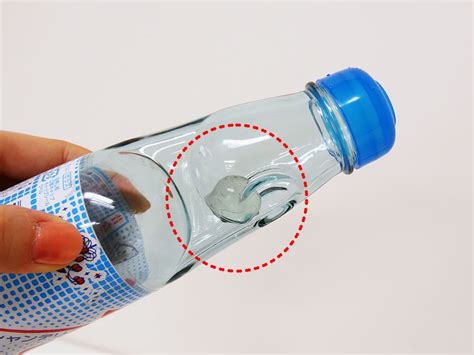 Why do Ramune bottles have marbles?