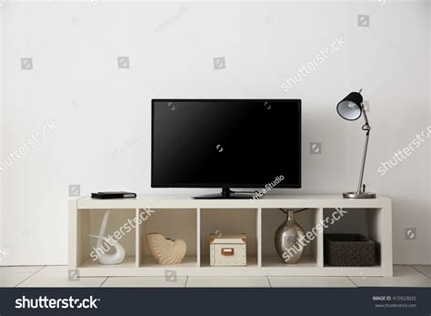 Wide Screen Tv On White Stand Near Light Wall Stock Photo 415923025 : Shutterstock