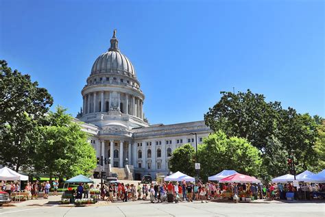 Wisconsin State Capitol building with farmers market around it ...