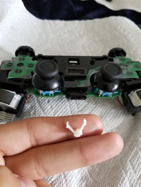 Just took apart a broken ps4 controller. Whats this white thing used ...