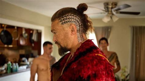 Jason Momoa shows off new head tattoo as he heads to Aotearoa