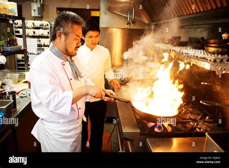 A chef stir frying with a wok, at a Korean restaurant Stock Photo, Royalty Free Image: 43427388 ...