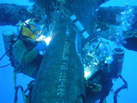 Welder-divers wet welding on damaged oil production platform. Photo courtesy of Oxylance ...