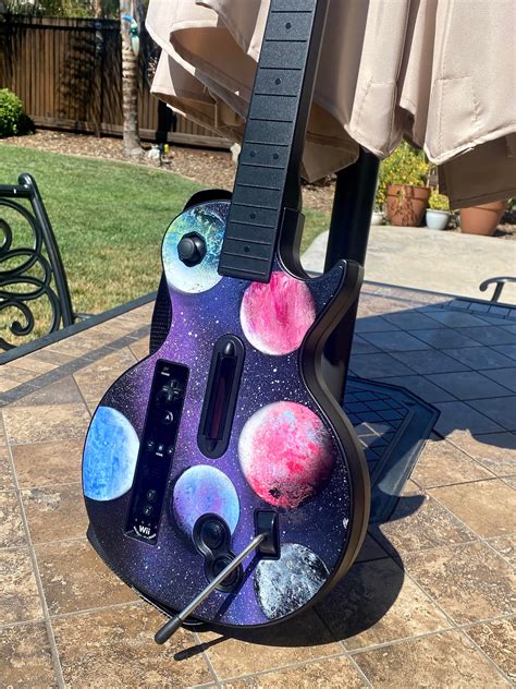 Painted my boyfriend’s Guitar Hero guitar :) : r/painting