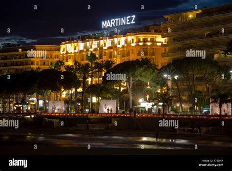 The beach promenade of Cannes at night Stock Photo - Alamy