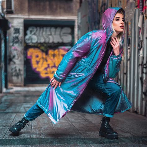 Stylish female in vibrant raincoat on street · Free Stock Photo