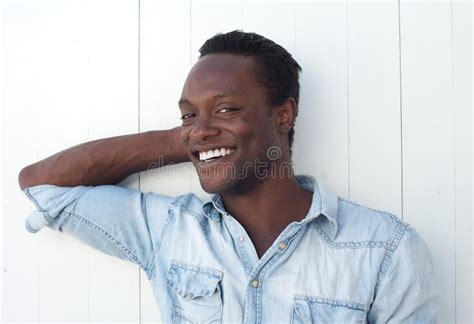 Happy Young Black Man Smiling Against White Background Outdoors Stock Photo - Image: 32816096