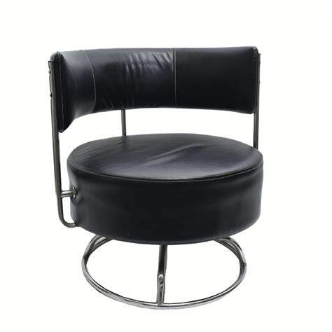 Mid Century Modern Chrome and Faux Leather Swivel Chair | EBTH