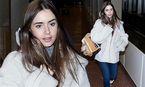 Lily Collins bundles up in faux fur as she arrives make-up free for ...