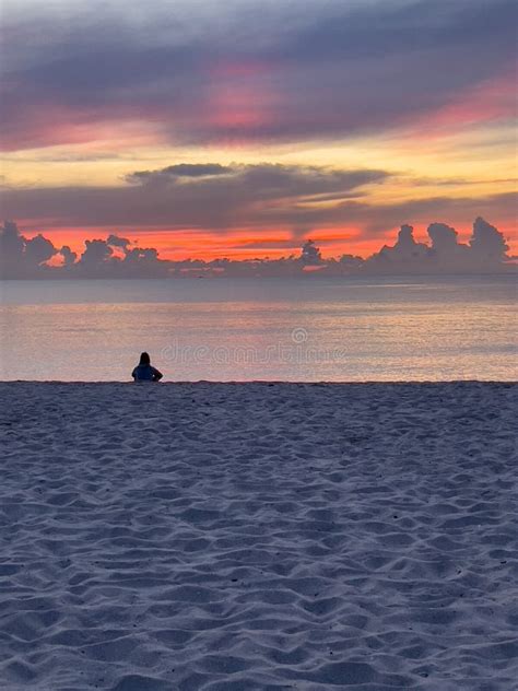 Man Sitting Alone on Beach at Sunrise Stock Image - Image of lifestyle ...