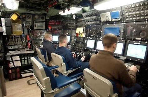 Members of the crew sit at the controls aboard the Seawolf Class fast ...