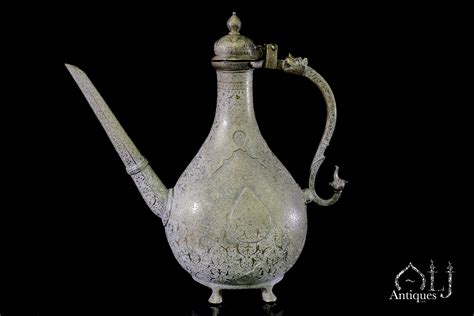 A Finely Engraved Deccani Bronze Ewer (Aftaba), The Handle Terminals ...