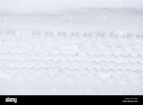 tyre tracks in the snow Stock Photo - Alamy