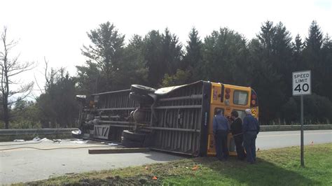 Photos: Crash causes school bus to overturn