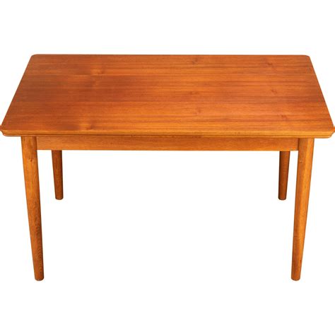 Refined Italian Teak Extendable Dining Table with Brass Accents For Sale at 1stDibs