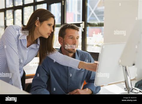 Business people in office using computer Stock Photo - Alamy