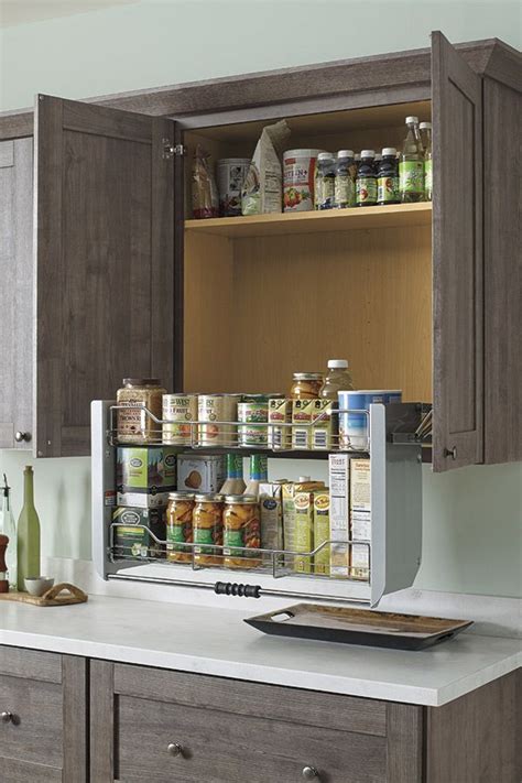 Our two-tiered Pull Down Cabinet Shelf brings items in wall cabinets within easy counter-level ...