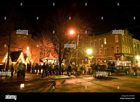 Candlelight stroll Christmas time Cooperstown New York horse drawn carriage rides Main Street ...