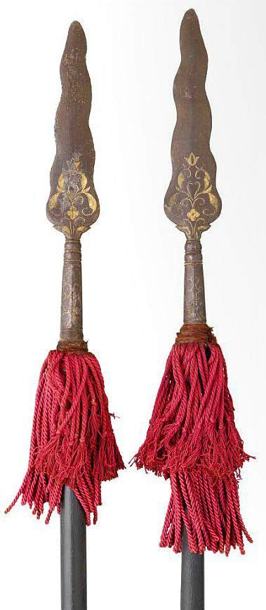 Indian spears, 18th to 19th century, each with leaf-shaped blade formed with a wavy edge ...