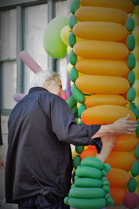 Having a chat with a man in a balloon costume at an art festival. [3963 ...