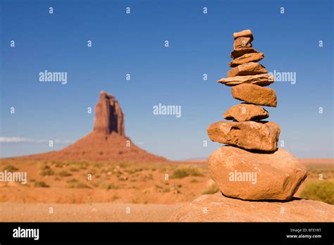 Stacked sedimentary rocks with Mesa rock formation in background - Utah ...