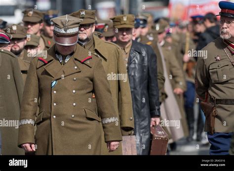 About 250 reenactors dressed in historical Polish Army, Border Protection Corps and State Police ...