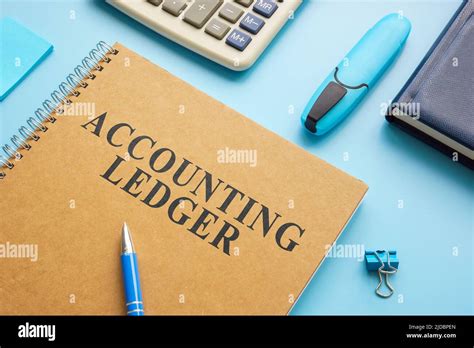 Accounting ledger, notepad and calculator on the desk Stock Photo - Alamy