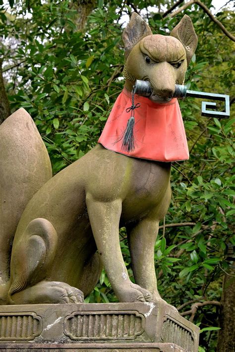 Fox Holding Key at Fushimi Inari Taisha in Kyoto, Japan - Encircle Photos