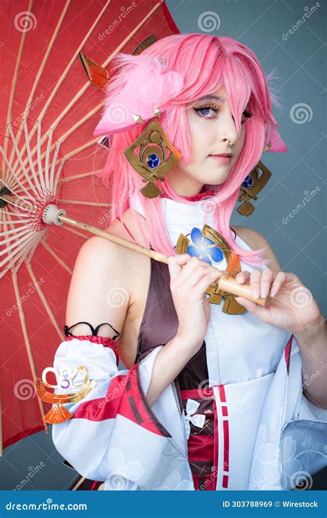 Female Cosplayer in a Pink Anime Costume Wearing Pink Hair Stock Image - Image of victorious ...