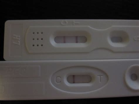 testing hcg with both ovulation test and pregnancy test. two different ...